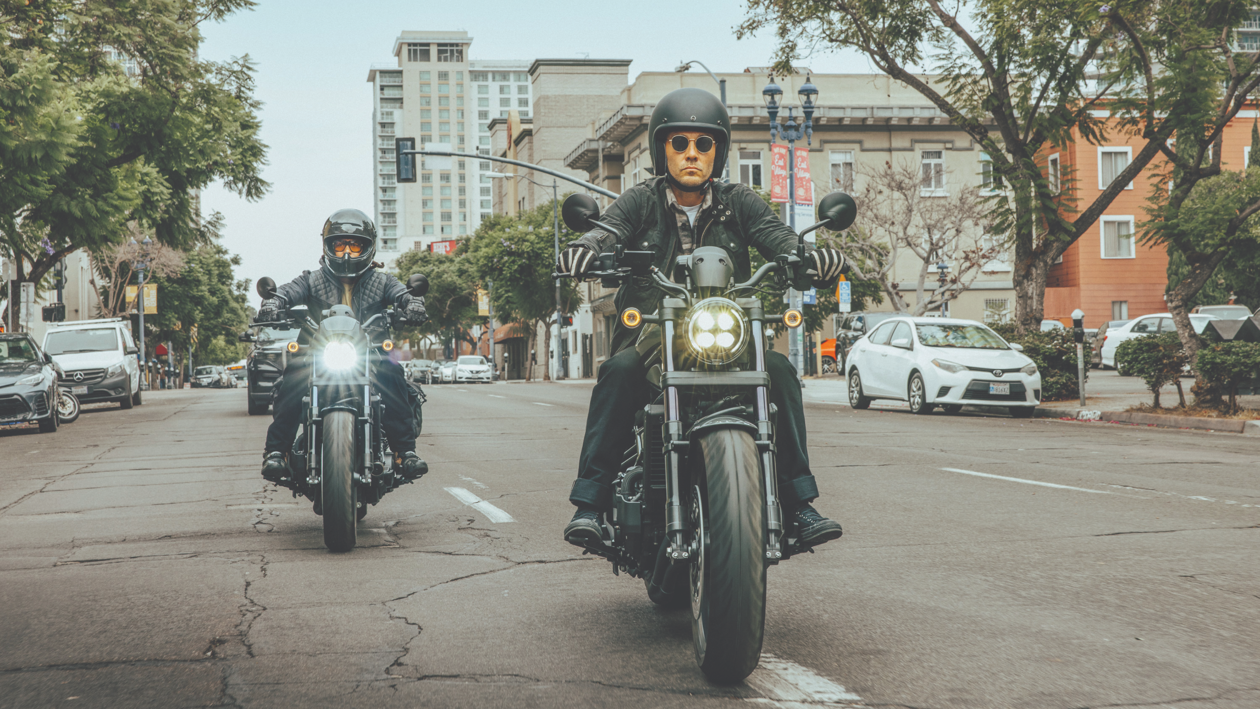 Two riders on a Honda Rebel